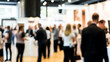 © Htet Wai Phyo - Trade Exhibition Blur: Out-of-focus view of a business trade show with display booths.