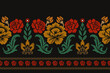 © Pacharaphun - Embroidered Ikat flower pattern on a black background. Traditional ethnic ikat, Aztec abstract vector pattern, seamless pattern in tribal, folk embroidery and Mexican style.