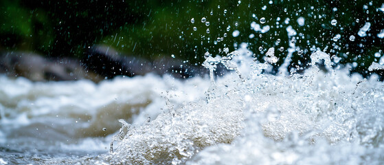 Aufkleber - torrential rainstorm with heavy raindrops creates splashes and ripples in fast flowing river, capturing dynamic energy of nature