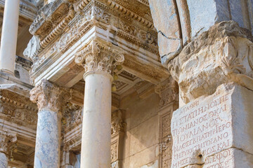 Wall Mural - Ancient architectural details of Celsus library in Ephesus, engraved text of emperor Trajan glorifying at Ancient Greek language, monument of epigraphy. Selcuk, Turkey (Turkiye)