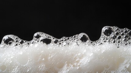 Poster - An image of soap foam and lather against a black background