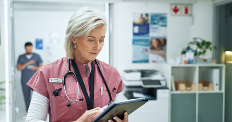 Poster - Tablet, woman and mature doctor in hospital with medical research, telehealth or feedback. Digital technology, reading and female healthcare worker with online surgery or treatment plan in clinic.