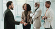 © HockleyMedia24/peopleimages.com - Collaboration, meeting and welcome with business people in office for introduction or orientation. Conversation, diversity and explain with happy employee group in corporate workplace for discussion