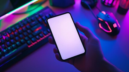 Aufkleber - A hand grasps a smartphone in a dimly lit room filled with vibrant light from a gaming setup. A keyboard and mouse sit on the desk, emphasizing the gamer atmosphere.