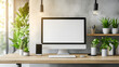 © Desinage - Modern dual monitor setup in a home office smartphone charging on a dock and potted plants adding warmth