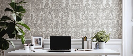 Poster - Minimalist modern home office desk with a laptop, and stationery on a white table against a wall with patterned wallpaper