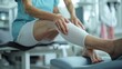 © AiAbstract - Detailed Shot of an Occupational Therapist Applying Treatment to a Senior Patient’s Leg in a Modern Rehabilitation Setting