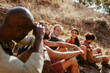 © Marko Geber - Group of hikers taking a break on a mountain trail