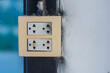 © Aphisith - double electrical outlet mounted on a wall.