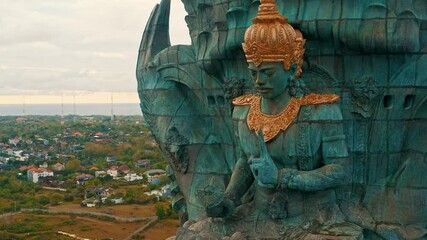 Wall Mural - Bali's Most Iconic Landmark Hindu God Garuda Wisnu Kencana statue also GWK statue is a 122-meter tall statue located in Garuda Wisnu Kencana Cultural Park, Bali, Indonesia