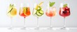 © Mandeep - refreshing summer cocktails in elegant glasses with fresh fruits and herbs
