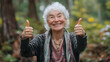 © Jan - Portait of old cheerful grandma showing thumbs up gesture, Happy girl giving thumb up, concept for success and happiness