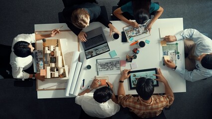 Poster - architect team discussing and pointing and presenting blueprint to interior designer. aerial view pr