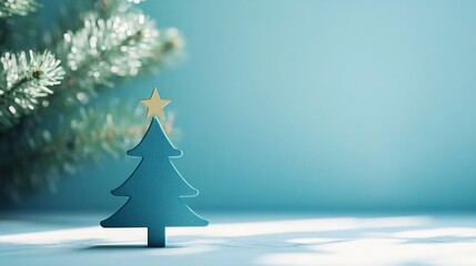 Blue christmas tree with golden star celebrating winter holidays