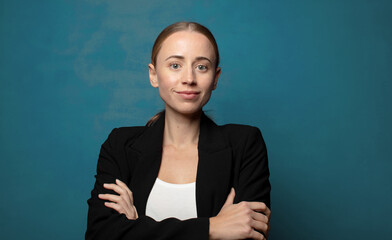 Wall Mural - smiling happily with a hand on hip and confident, positive, proud and friendly attitude