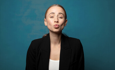 Wall Mural - pressing lips together with a cute, fun, happy, lovely expression, sending a kiss