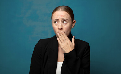 Wall Mural - covering mouth with hands with a shocked, surprised expression, keeping a secret or saying oops