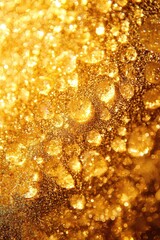 Wall Mural - Golden water droplets as an abstract background