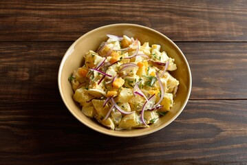 Wall Mural - Warm potato salad with egg, pickle, red onion with mayonnaise an