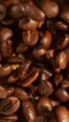 Aufkleber - Super Slow Motion of Falling Coffee Beans on Pile. Concept of Roasting Coffee Beans. Filmed on High Speed Cinema Camera, 1000 fps. Vertical Aspect Ratio.