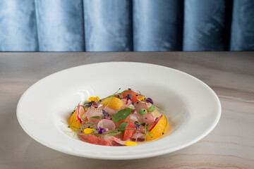 Wall Mural - swordfish carpaccio with orange grapefruit radish and flowers