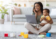 © Prostock-studio - Remote Business. Portrait Of Happy Black Woman With Baby Working With Laptop And Cellphone At Home, Busy Young African American Lady Using Laptop And Mobile Phone For Online Work, Copy Space