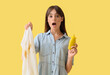 © Pixel-Shot - Shocked young woman with stained clothes and mustard on yellow background