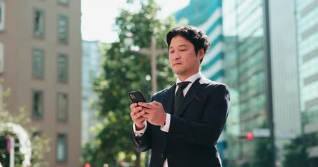 Aufkleber - Business man, phone and texting in street, thinking and reading for negotiation, deal or chat in city. Person, smartphone and scroll with mobile app, notification or networking on urban road in Japan