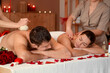 © Pixel-Shot - Young couple getting massage in dark spa salon on Valentine's Day