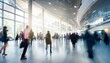 © SSuperTier - An abstract blur of people at an exhibition hall during a trade show or expo event. The scene depicts a business convention or job fair, serving as a dynamic backdrop for a business-related concept.