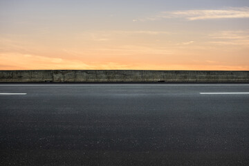 Side view of asphalt road with landscape of sunset sky. road background.