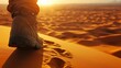 © Natthithin - Close-Up of a Boot Sole Leaving Footprints on Soft Sand During Sunset in a Desert Landscape, Symbolizing Adventure and Exploration