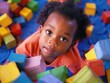 © vefimov - A baby exploring colorful stacking blocks, a classic educational toy for early childhood development.
