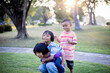 © chaunpis - group of cute asian kids having fun in the park