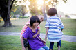 © chaunpis - group of cute asian kids having fun in the park