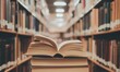 © Vergiliy - Open book on stack, library background, shelves filled with books, warm lighting, inviting atmosphere