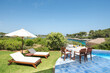 © ADDICTIVE STOCK - Coastal Retreat with Outdoor Scenes and Poolside Relaxation at Hotel