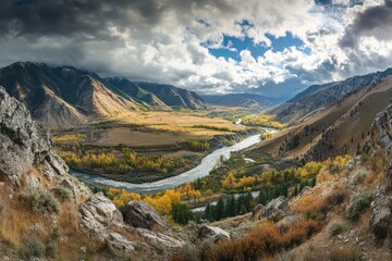 Poster - Winding River Through a Mountain Valley with Autumn Foliage and Dramatic Clouds