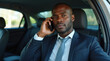 © Анатолий - Serious Business Conversation in the Backseat of a Car by a Well-Dressed Man