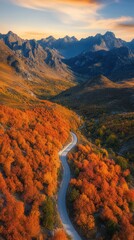 Poster - Aerial view of a winding mountain road through vibrant autumn foliage in a scenic landscape during sunset