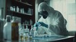 © Boinah - A person in protective gear conducts experiments in a laboratory setting.