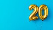 © ryanbagoez - Banner with number 20 golden balloon with copy space. thirty years anniversary celebration concept on a blue background