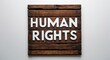© Erlinda - human rights lettering on medieval ancient sign wooden board on plain white background