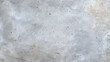smooth, polished concrete texture with subtle variations in color and small speckles, viewed from above, creating minimalist and industrial aesthetic