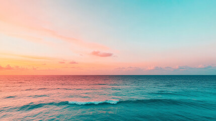 Poster - Serene Sunset Seascape:  A breathtaking view of a serene sunset over the ocean, where soft hues of pink and blue paint the sky and the vast waters below.