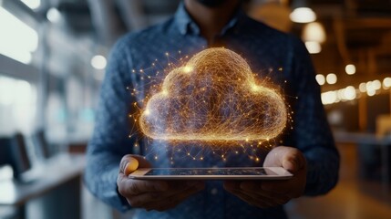 Leinwandbilder - A person is holding a tablet with a glowing digital cloud symbol above it, set in a contemporary office environment. The glowing design signifies data storage and technology integration.