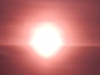 Poster - Abstract violet sky with white sun and thin fine structure of clouds - sunny background. Topics: sun energy, sunlight, weather, evening, sunset, atmosphere, air space, meteorology, climate