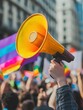 © Johannes - Gay and transgender people protest at lgbt pride event for equality rights outdoors in the city - Focus on hand holding megaphone