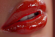 © EliteStock - Close-up of glossy red lips, showcasing a vibrant and alluring shine that captures attention and evokes a sense of beauty and seduction.