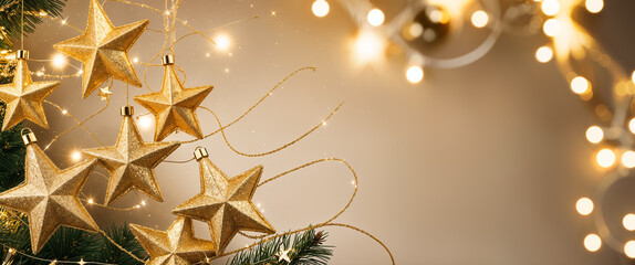 Wall Mural - Golden christmas stars hanging on a decorated christmas tree with sparkling lights